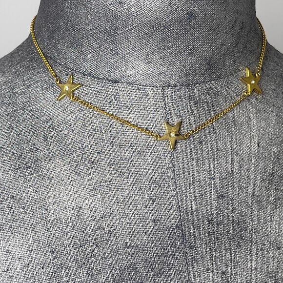 The Unbranded Brand Jewelry - necklace costume jewelry gold chain link three stars star rhinestone center